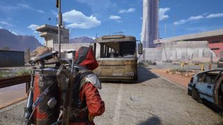 Arc Raiders A Wrench in the Works: A player looking at a wrecked bus on a main road at the western gate.