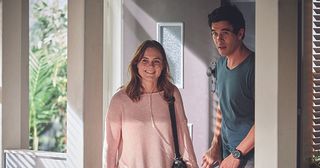 Beth Ellis is greeted by Justin Morgan after retuning from the hospital in Home and Away.