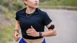 The FLOWBIO S1 attached to a woman's arm while running