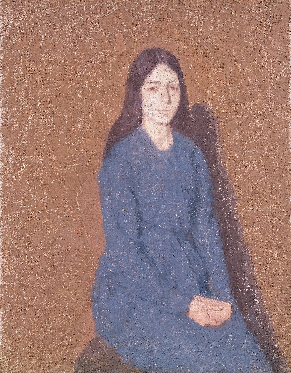 Portrait of a sombre young woman in a blue dress