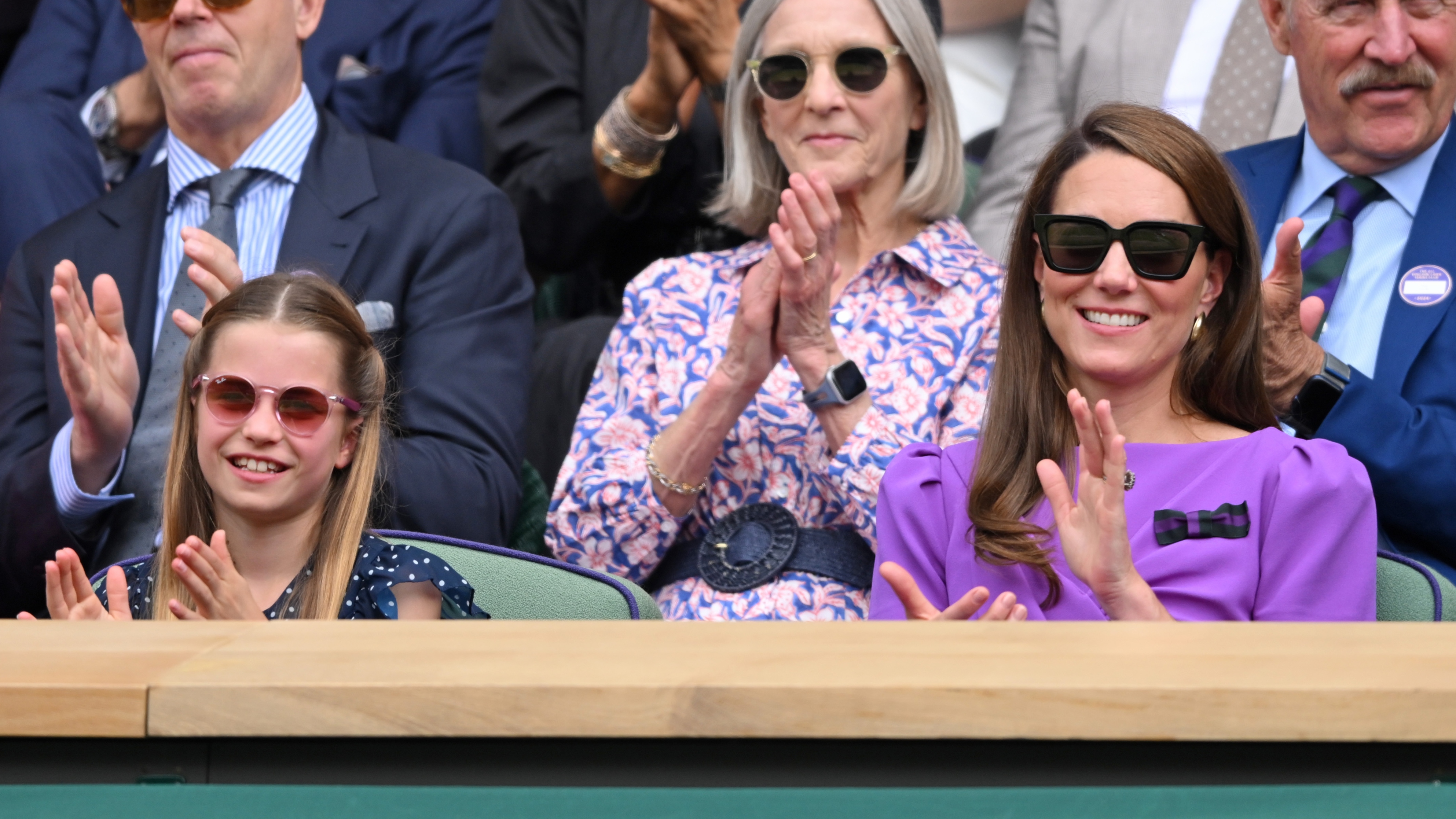 Princess Charlotte of Wales and Catherine, Princess of Wales smiling court-side of Centre Court at Wimbledon 2024