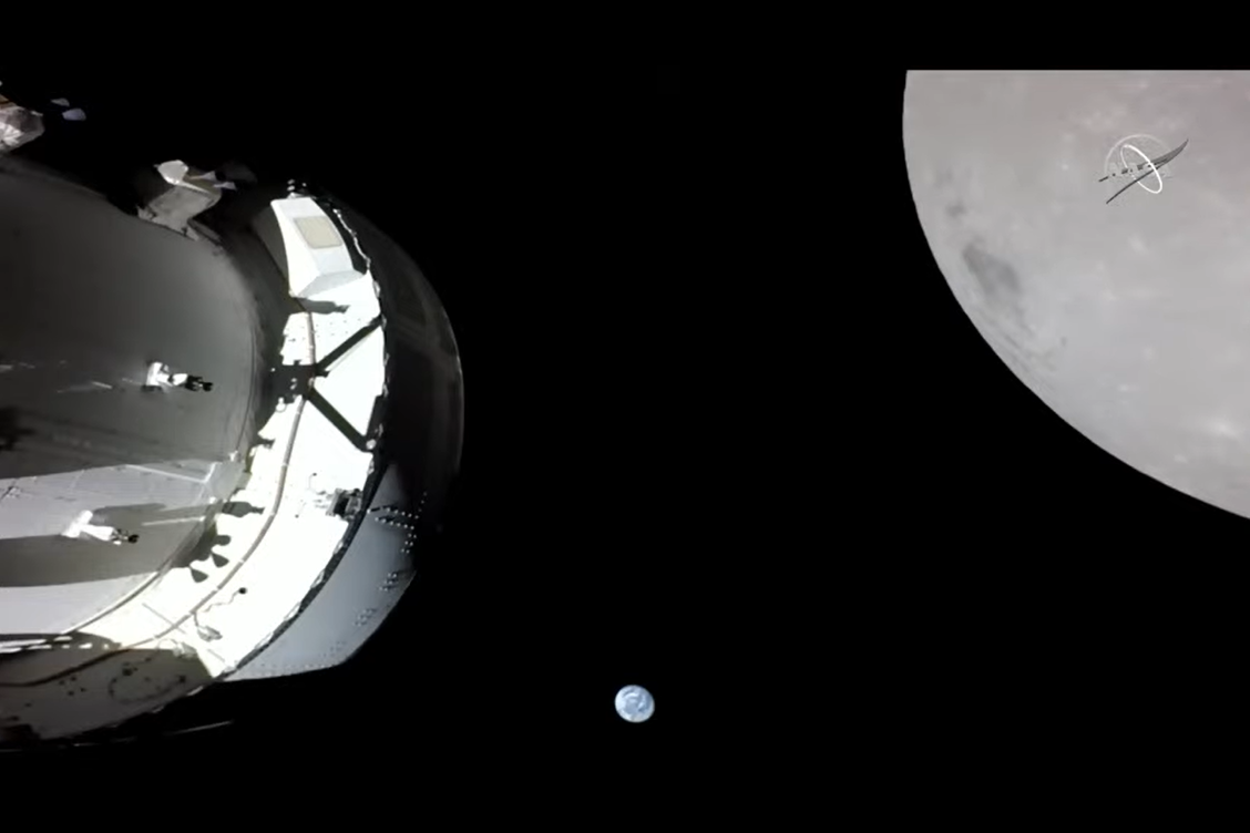A live view of Earth (in the distance) and the moon (at right) from the NASA Orion spacecraft of Artemis 1 on Nov. 21, 2022.