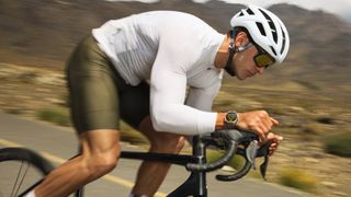 Promotional images of the HUAWEI WATCH GT6 on a cyclist speeding along a road