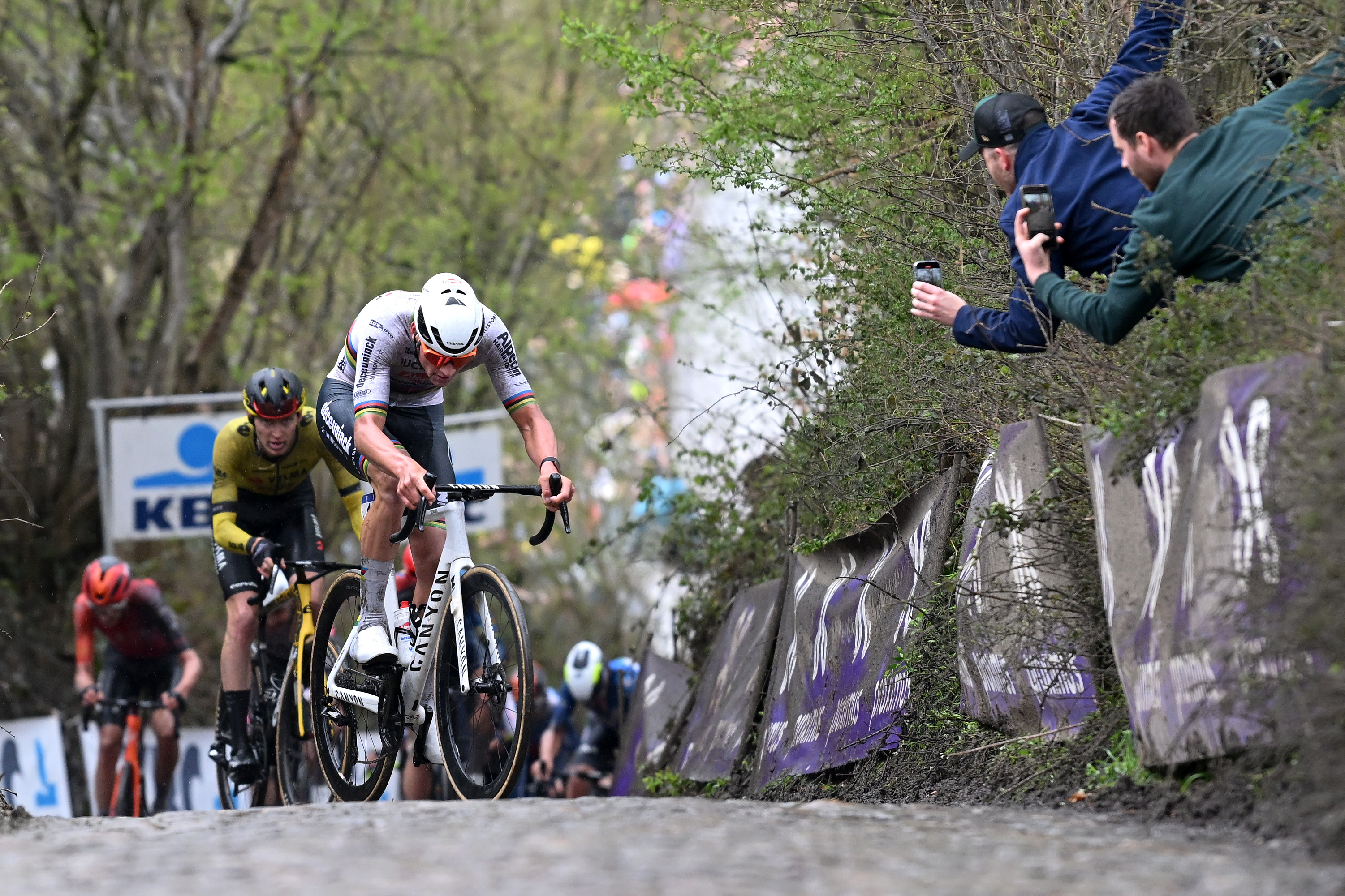 Mathieu van der Poel hauls himself up the famous Koppenberg climb
