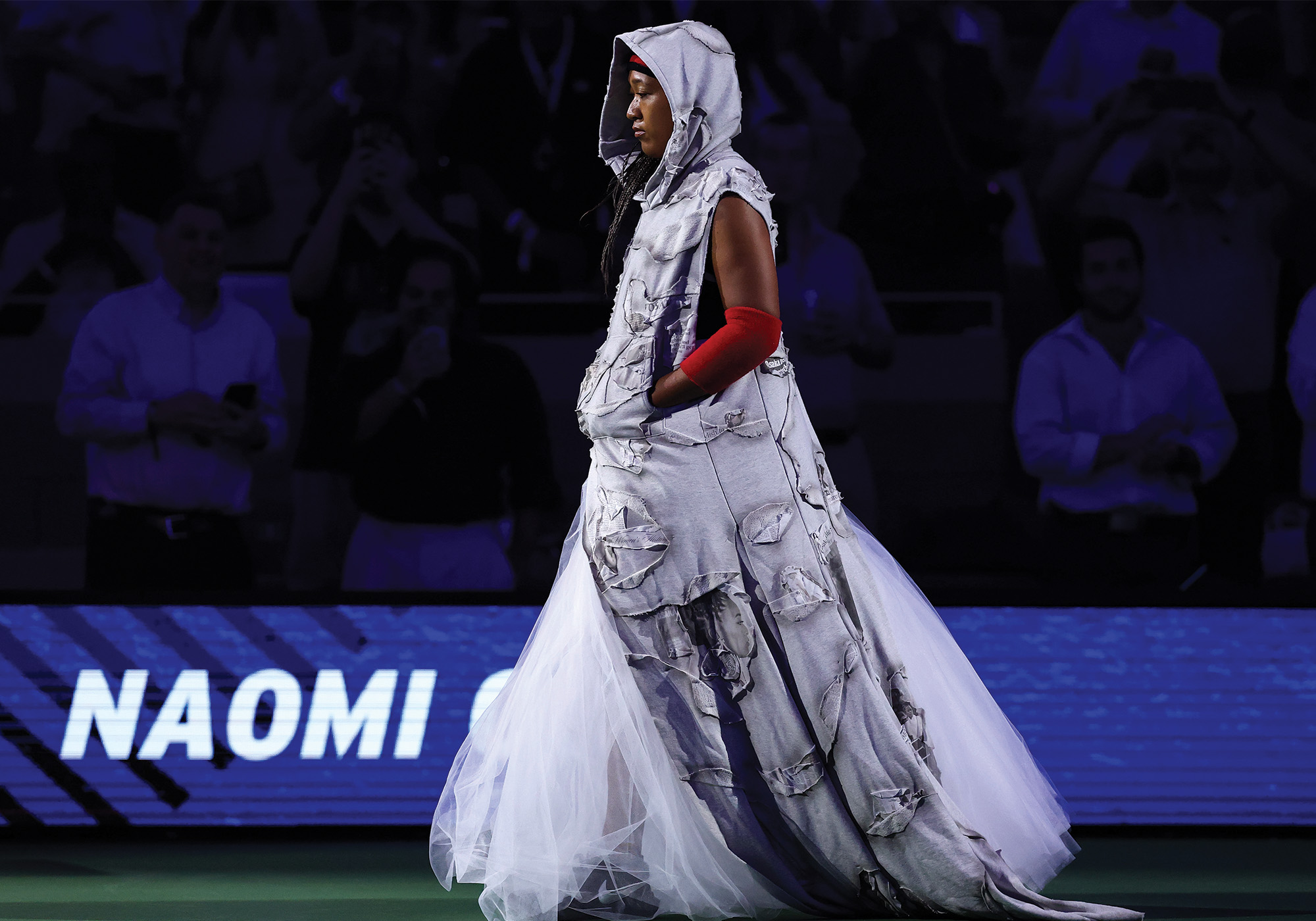 Naomi Osaka of Japan walks onto the court against Anastasia Zakharova during their Women's Singles First Round match on Day Two of the 2026 US Open.