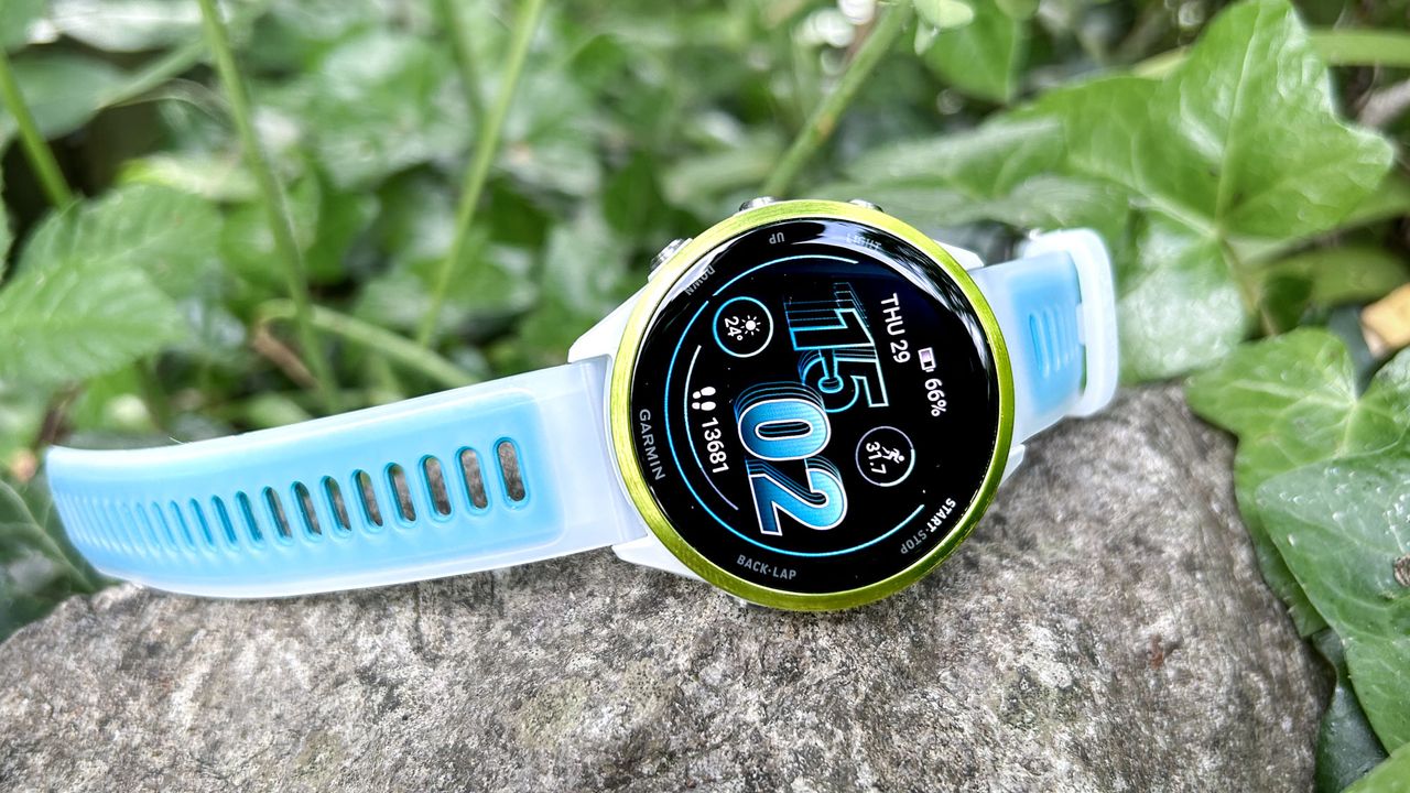 Garmin Forerunner 570 on its side on a rock outside