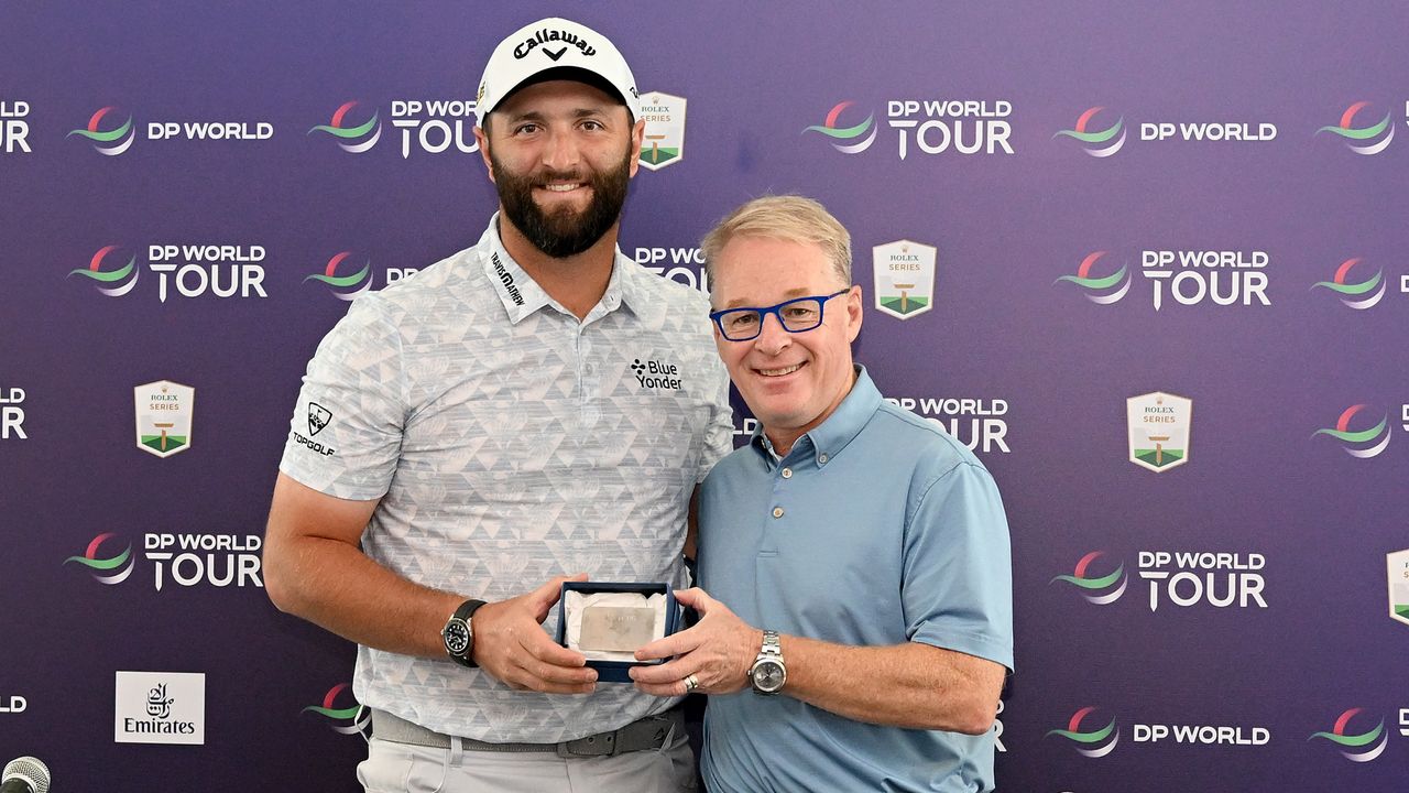 Jon Rahm and Keith Pelley with Rahm&#039;s DP World Tour Honorary Life Membership card