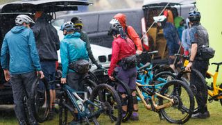 Riders loading their bikes in the rain