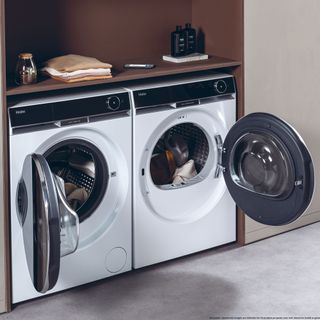 Haier washing machine and tumble dryer side by side amongst built-in cabinetry