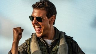 Tom Cruise pumps his fist in excitement in Top Gun: Maverick. 