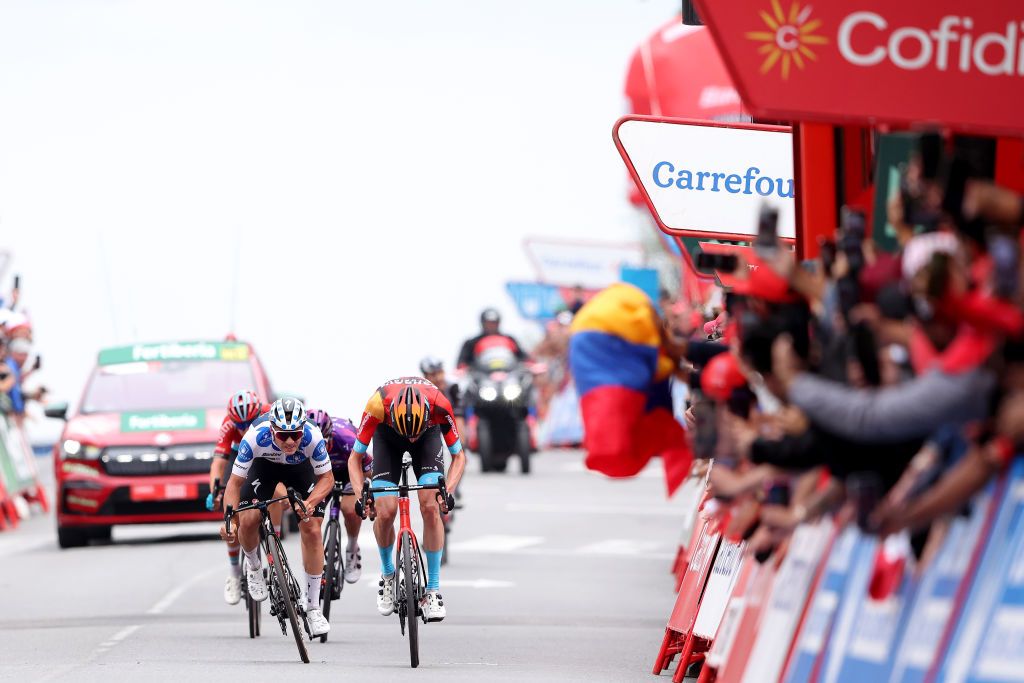 GUADARRAMA SPAIN SEPTEMBER 16 LR Remco Evenepoel of Belgium and Team Soudal Quick Step Polka dot Mountain Jersey and Wout Poels of The Netherlands and Team Bahrain Victorious sprint at finish line to win the stage during the 78th Tour of Spain 2023 Stage 20 a 2078km stage from Manzanares El Real to Guadarrama UCIWT on September 16 2023 in Guadarrama Spain Photo by Alexander HassensteinGetty Images