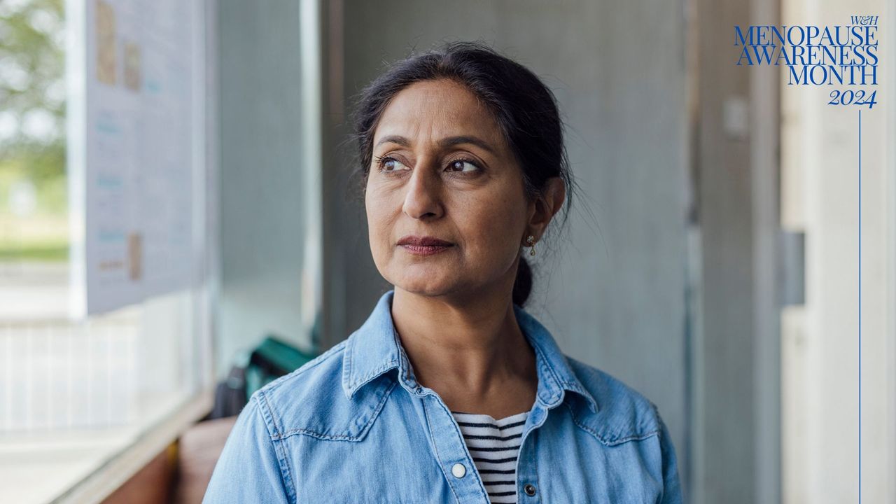 Woman wearing casual clothes looking out of window