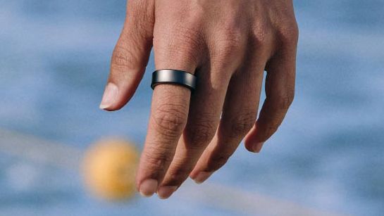 A hand with a Samsung Galaxy Ring on one finger