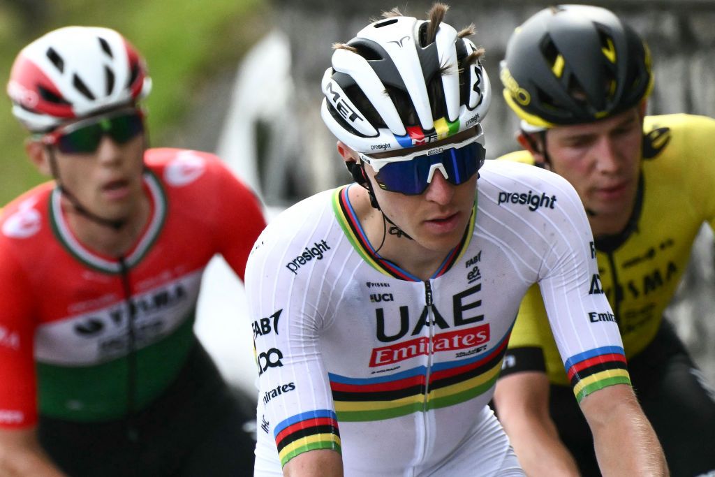 UAE Team Emirates team's Slovenian rider Tadej Pogacar (C) cycles with the pack of riders (peloton) during the 118th edition of the Giro di Lombardia (Tour of Lombardy), a 252km cycling race from Bergamo to Como on October 12, 2024. (Photo by Marco BERTORELLO / AFP)