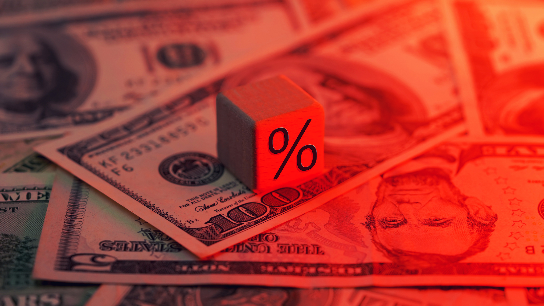red tone percentage % word block. Signifying hawkish and aggressive high interest rates