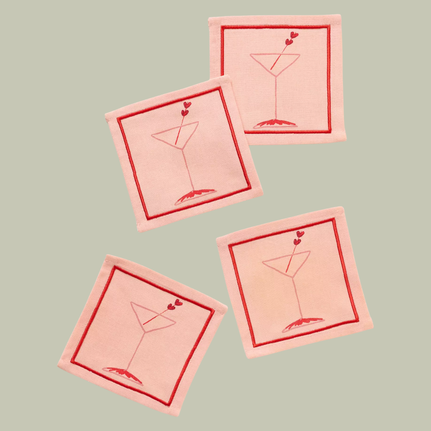 A set of four pink and red cocktail napkins
