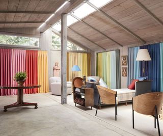 open plan living space with multicolored curtains