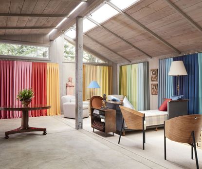 open plan living space with multicolored curtains 