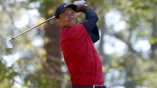 Tiger Woods plays a tee shot during the final round of the 2022 Masters