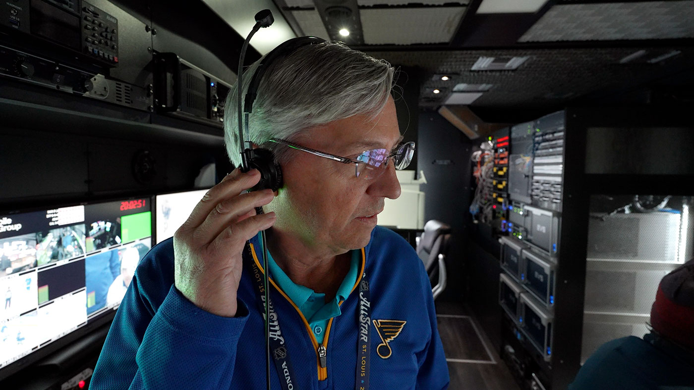 Joe Geerling wears a headset inside the production truck.