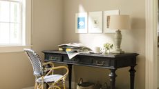 beige room with black desk