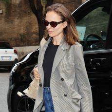 Natalie Portman wearing a blazer and jeans
