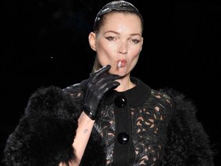 Kate Moss smokes a cigarette on the Louis Vuitton runway