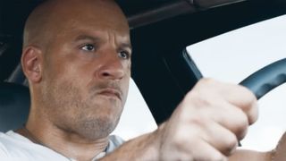 Vin Diesel as Dom Toretto in Fast X, angrily driving a car