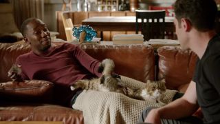 Winston (Lamorne Morris) with his cat, Ferguson