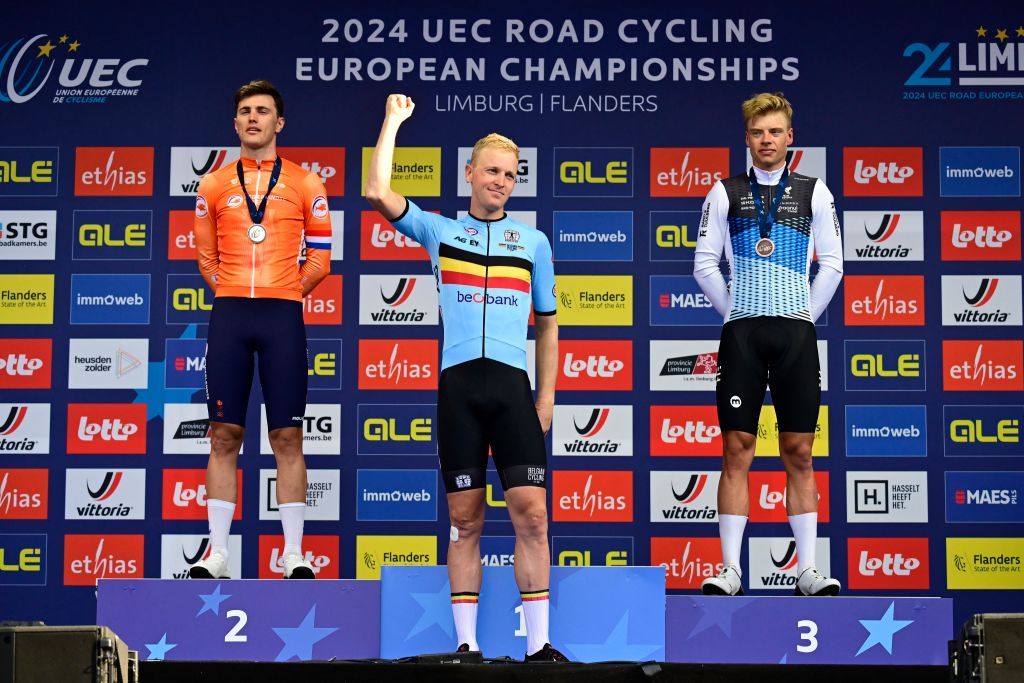 L-R, second Dutch Olav Kooij, Europen champion Belgian Tim Merlier and Estonian Madis Mihkels celebrate on the podium at the Men's Elite Road Race at the European Championship 2024, in Hasselt, Sunday 15 September 2024. The UEC Road European Championships 2024 will take place from 11 to 15 september in Limburg, Belgium. BELGA PHOTO DIRK WAEM (Photo by DIRK WAEM / BELGA MAG / Belga via AFP)
