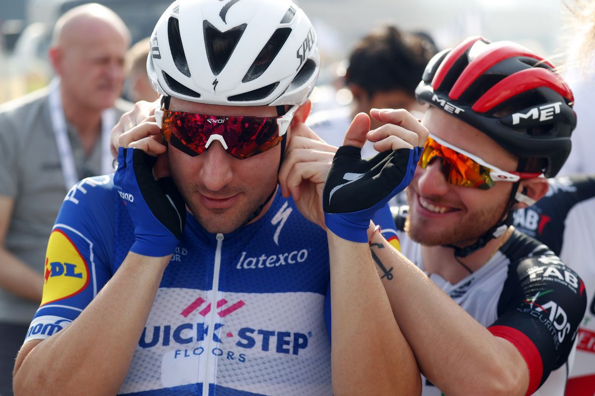 Simoni Consonni gives Elia Viviani a playful tug on the ear
