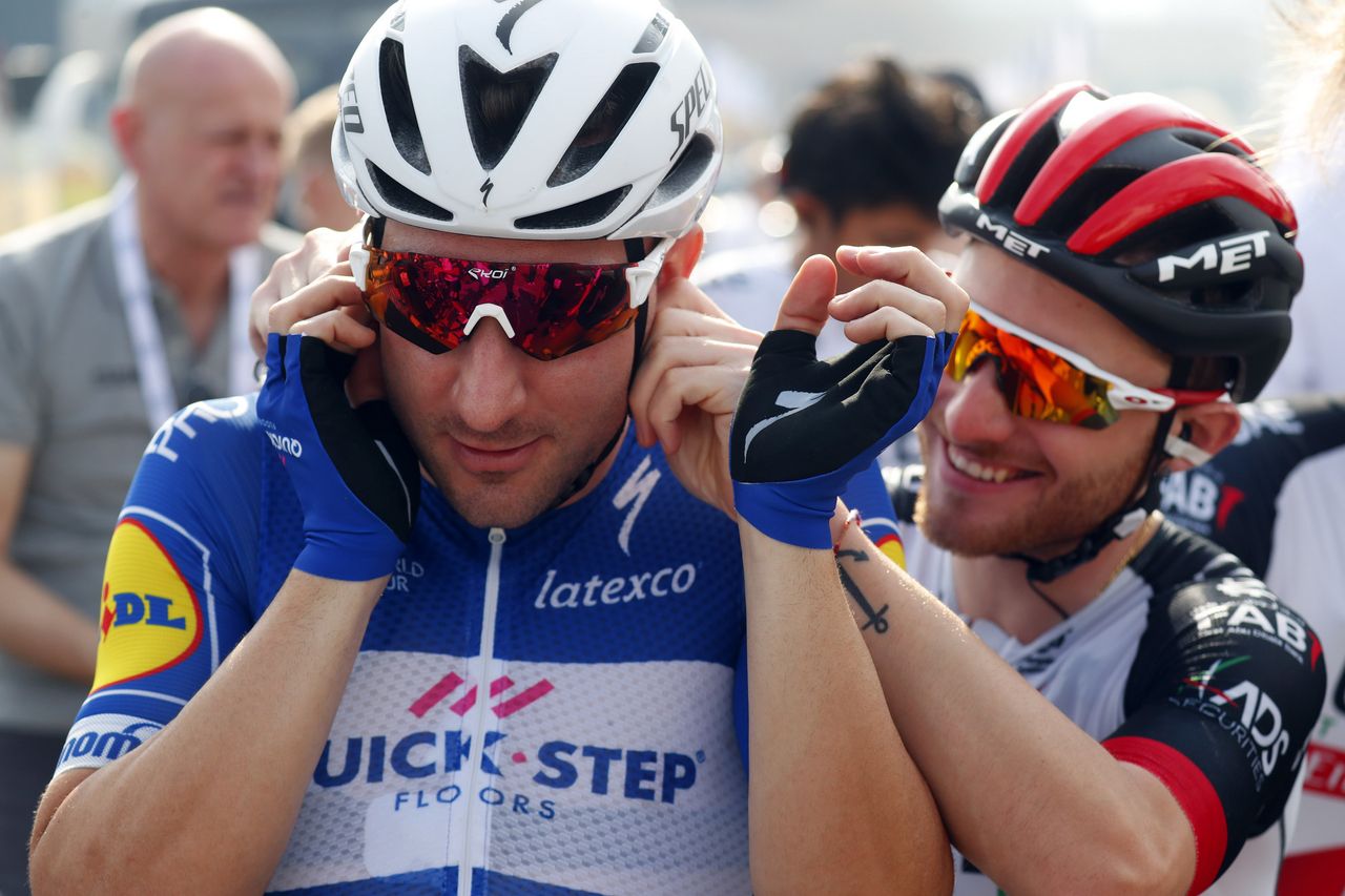 Simoni Consonni gives Elia Viviani a playful tug on the ear