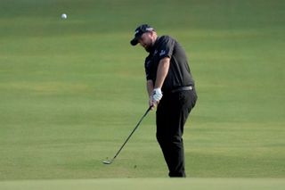 Shane Lowry of Ireland chips on the 12th green during the second round of the Wyndham Championship at Sedgefield Country Club on August 05, 2022 in Greensboro, North Carolina.