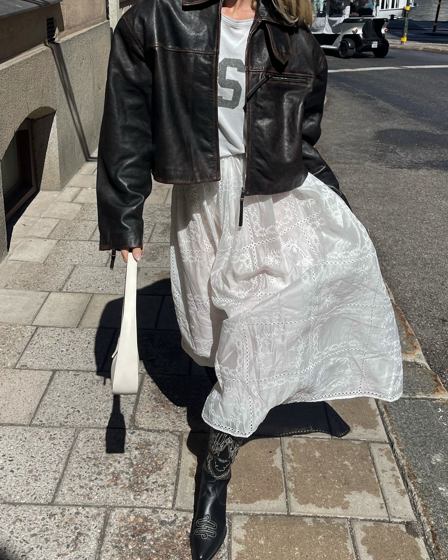Model Elsa Hosk wears the tiered white maxi skirt london girl trend.