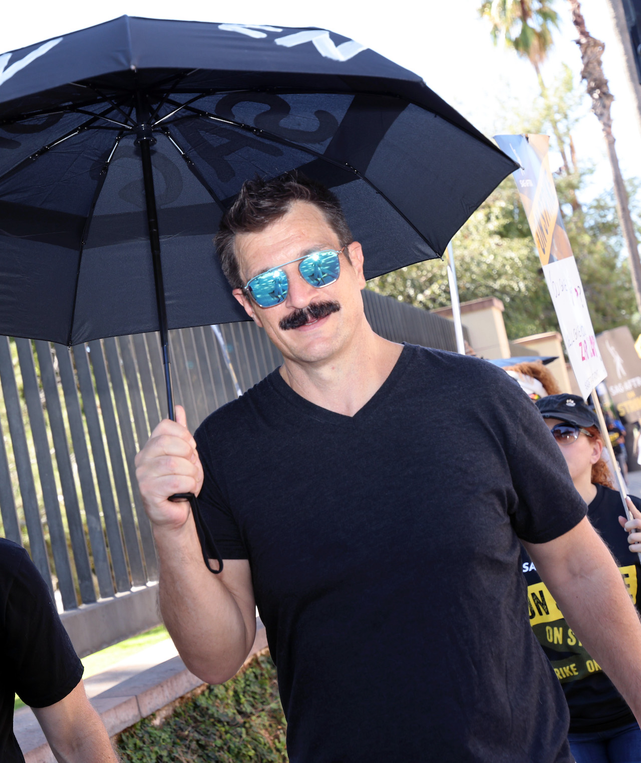 Nathan Fillion joins the picket line outside Warner Bros. Studios on October 06, 2023 in Burbank, California.