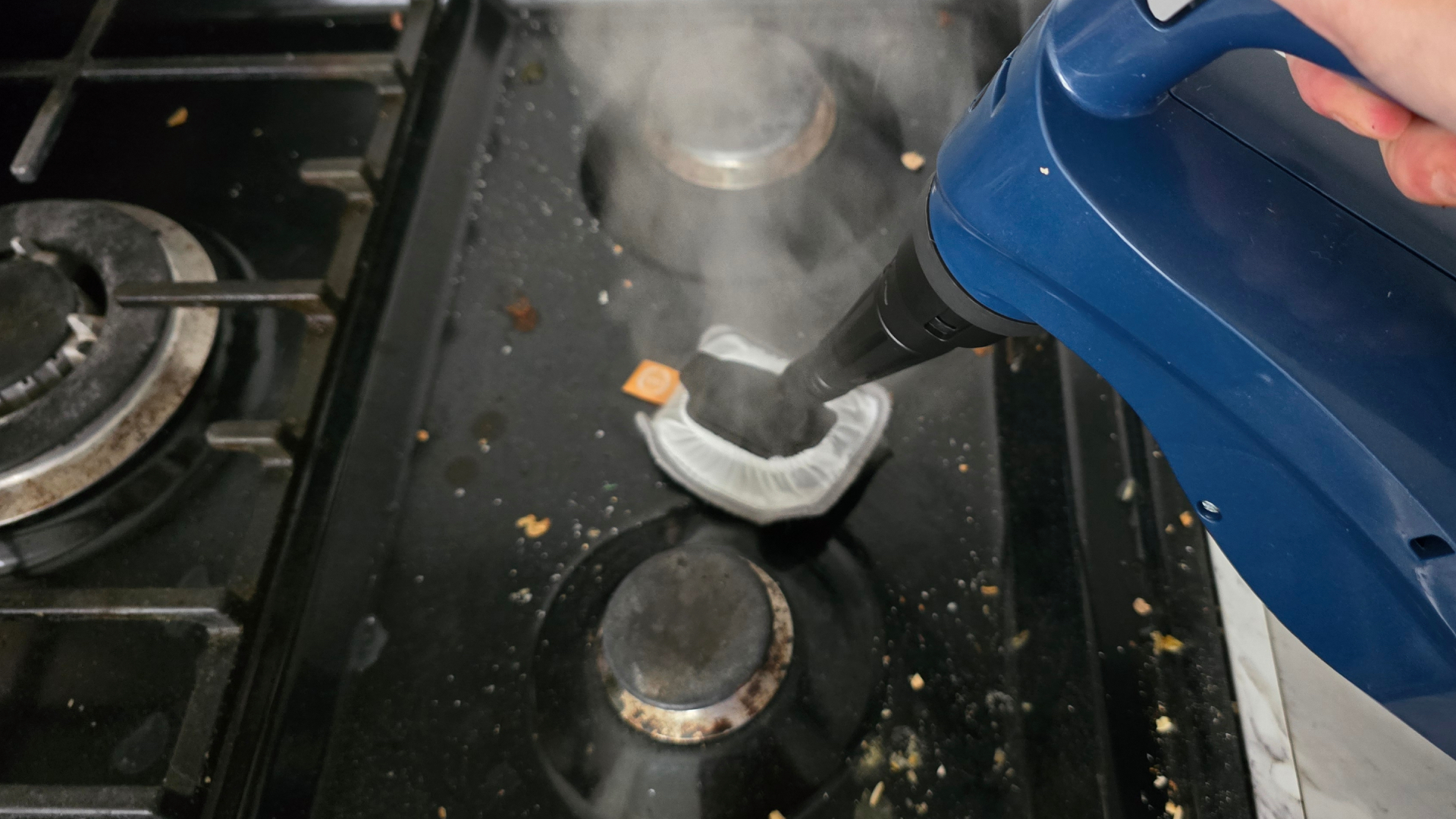 Vax Steam Fresh Total Home cleaning black enamel hob with steam