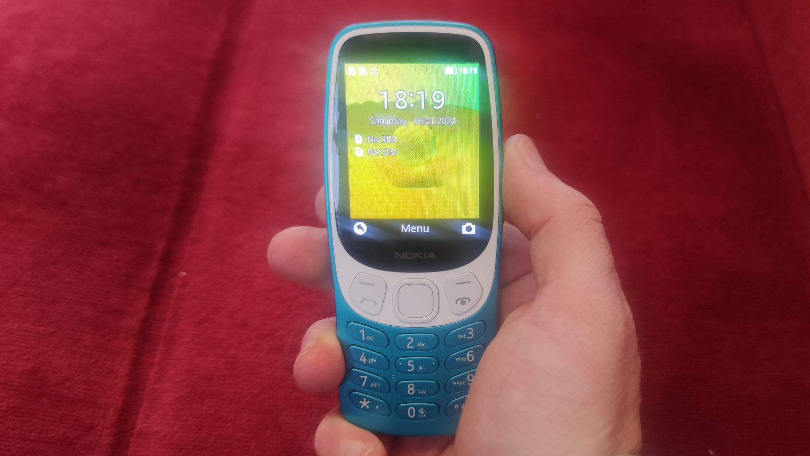 The Nokia 3210 on a red background.