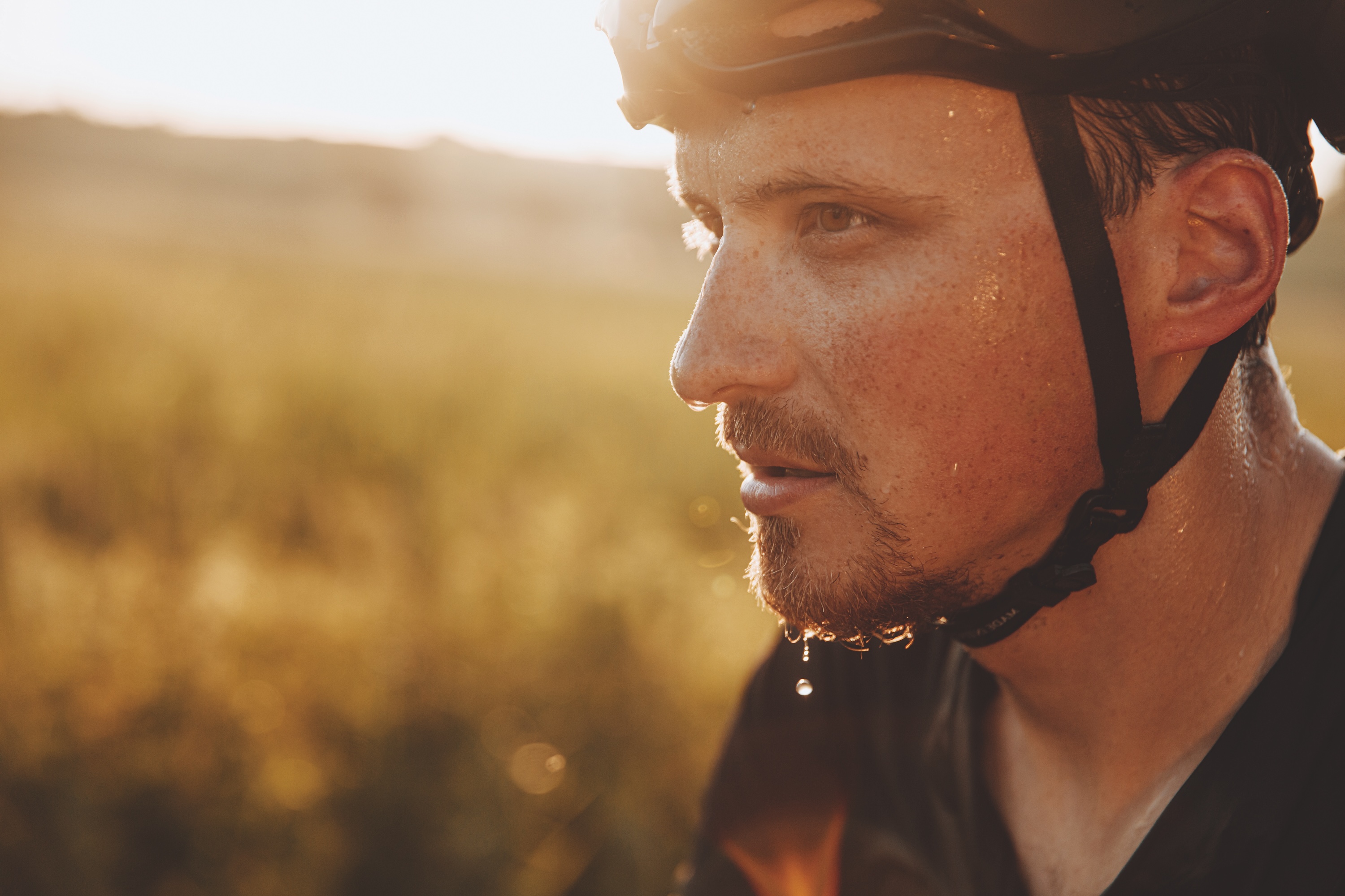 A male bike rider with a sweaty face