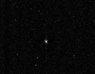 On it's way to Pluto, NASA's New Horizons spacecraft captured a view of Neptune and its large moon Triton on July 10, 2014, from roughly 2.45 billion miles (3.96 billion kilometers) away.