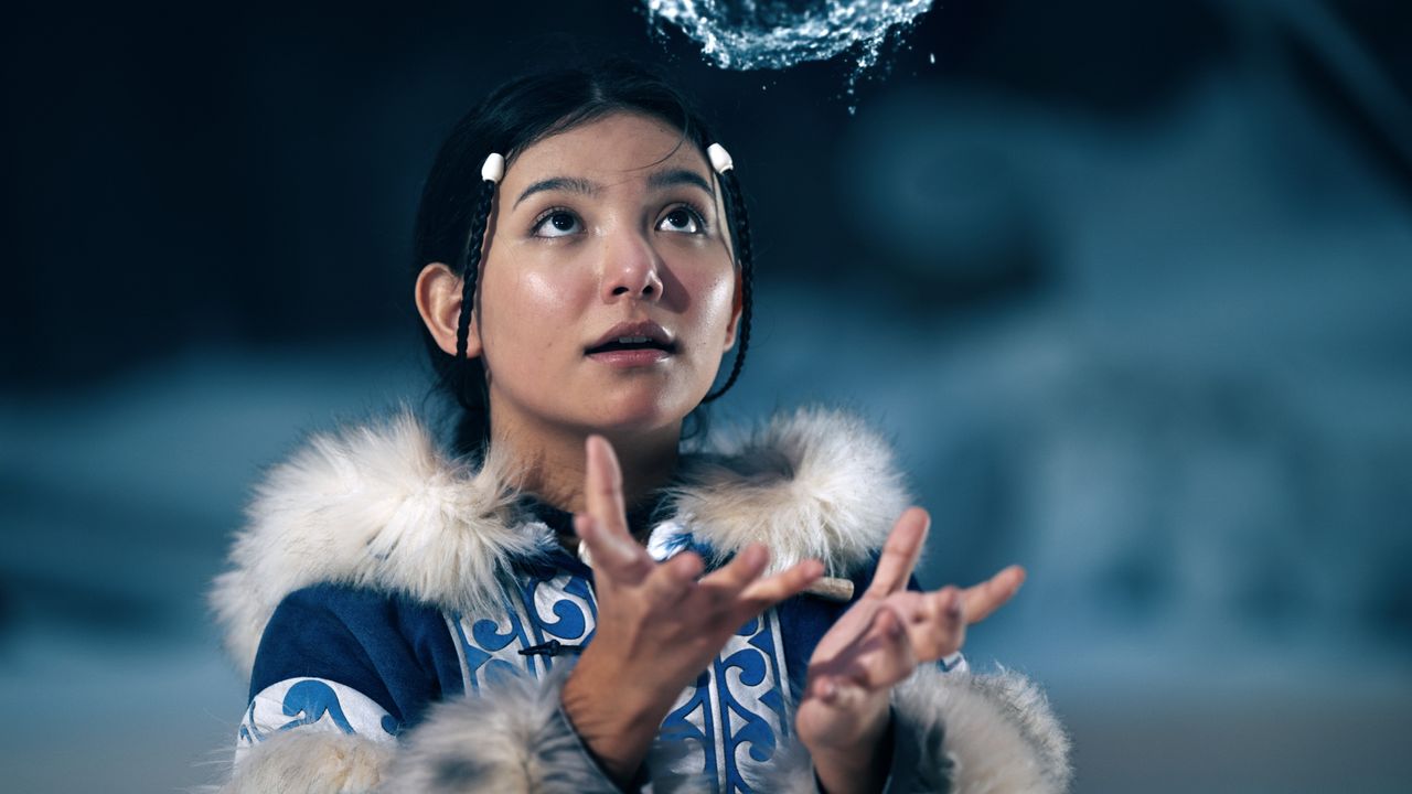 Kiawentiio in costume and waterbending as Katara in Netflix's Avatar: The Last Airbender