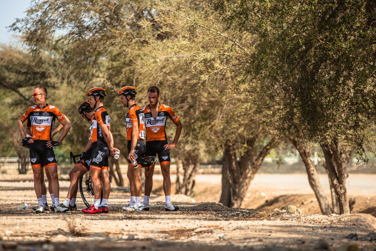 Team Roompot riders try and find some shade to cool down in