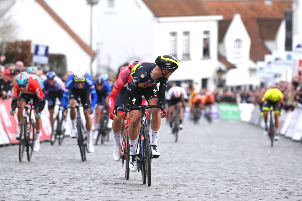 Tim Merlier checks on the competition at Nokere Koerse in 2023