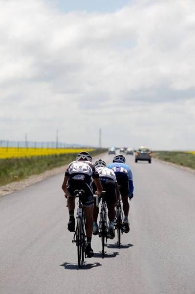 The leading trio on the long straight roads of stage 6.