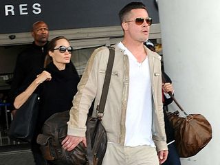 Angelina Jolie, Brad Pitt and Maddox arrive at LAX.