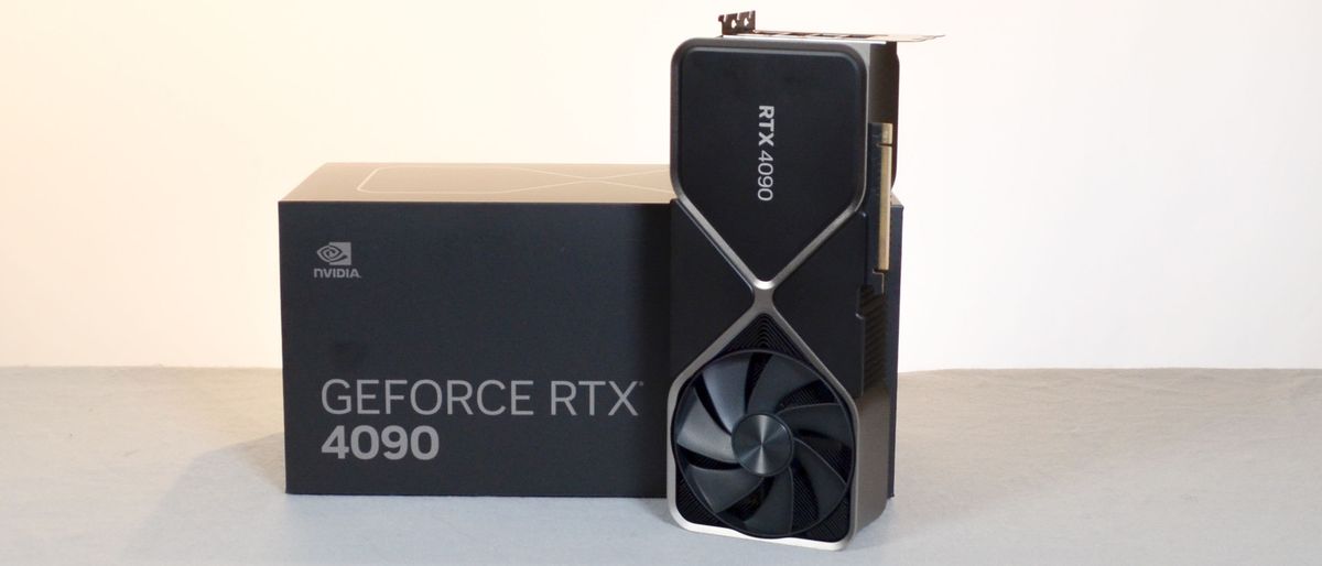 An Nvidia RTX 4090 standing upright next to its retail packaging