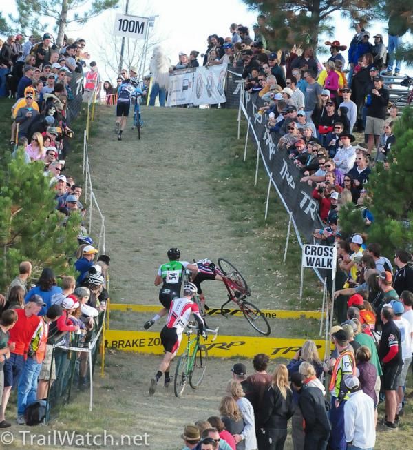 A rider crashes on the barriers.