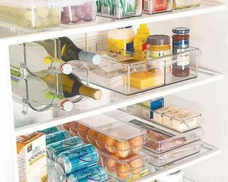 The Container Store organization products clear boxes in fridge
