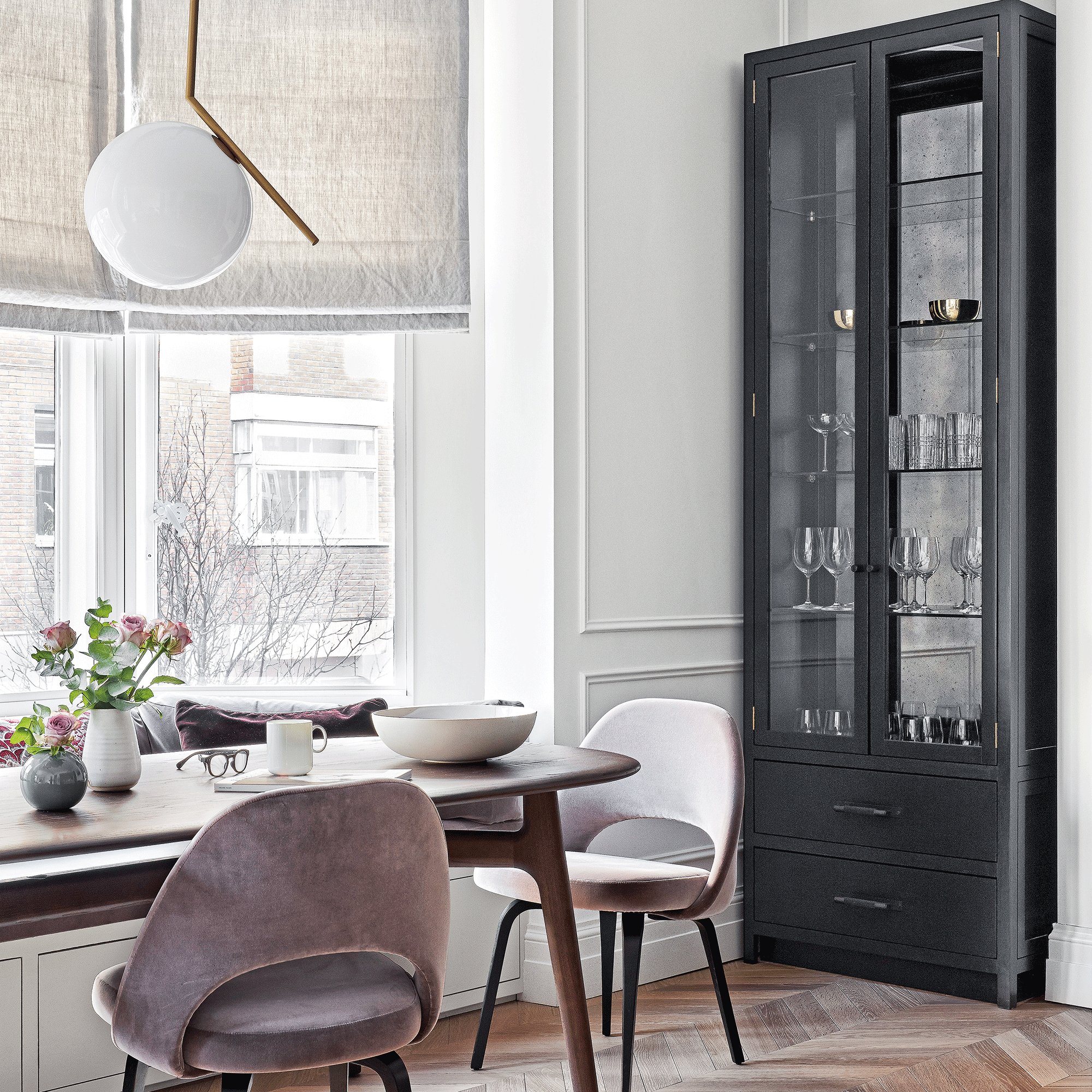 Grey small dining room with glass cabinet