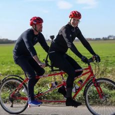 Prince William riding a tandem bike