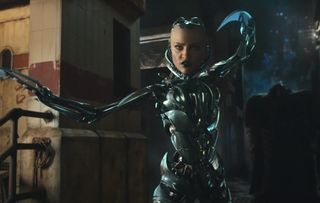 Eiza Gonzalez aims her blade hands towards the camera in Alita: Battle Angel.